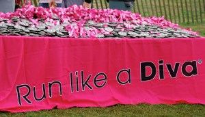 Finishers' medals from a Divas Half-Marathon. (Photo courtesy of Flickr)