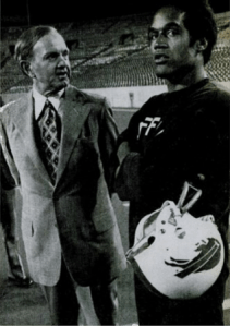Simpson with Bills owner Ralph Wilson (Ebony, 1976).