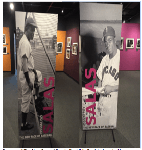 Banners of The New Face of Baseball exhibit. Depicted are Jackie Robinson (left) who in 1947 broke through the color line and Minnie Miñoso, the first Black Latino to play in the major leagues in 1949. Source: The New Face of Baseball at NBHOF (author’s own photo) 